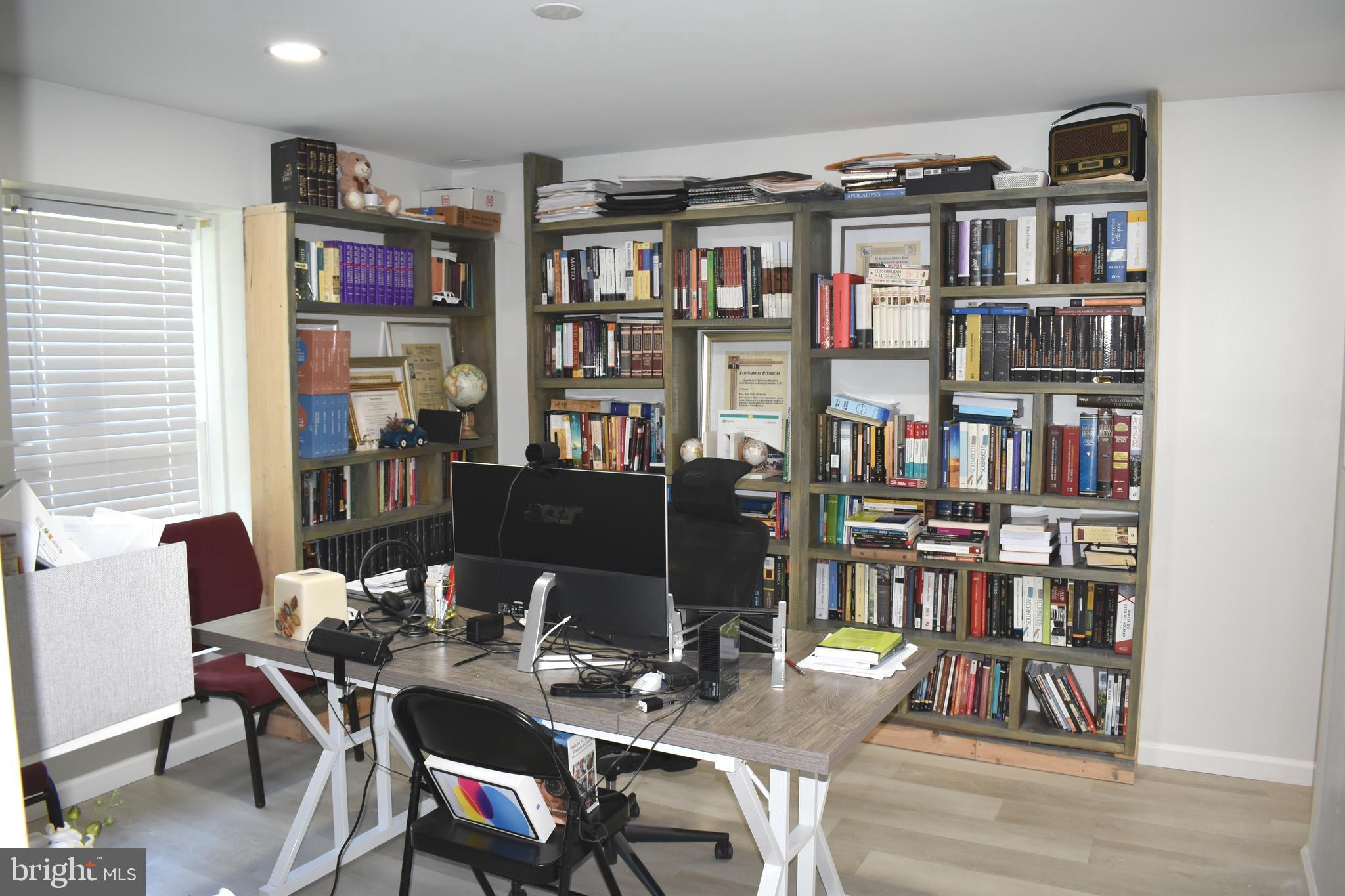 10958 Mountain Run Lake Road Culpeper, VA 22701 - Photo 24 of 31 a view of a workspace with furniture and toys