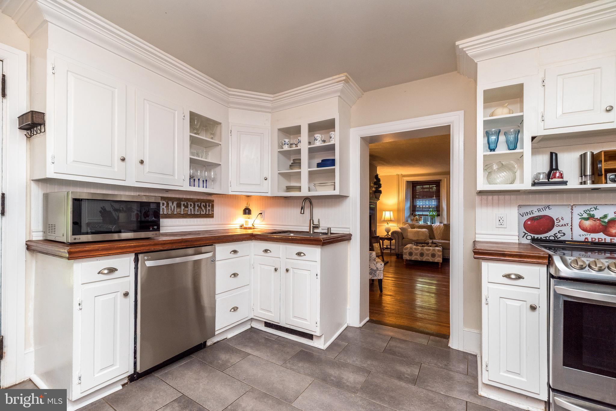 9022 Easton Road Ottsville, PA 18942 - Photo 12 of 45 a kitchen with stainless steel appliances granite countertop a stove and cabinets