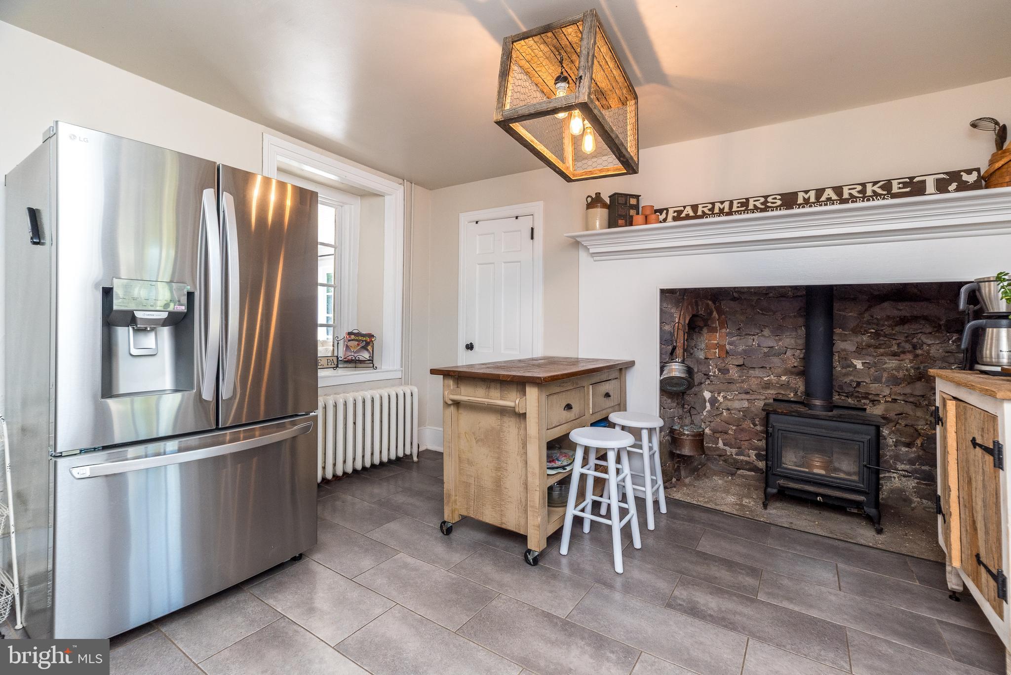 9022 Easton Road Ottsville, PA 18942 - Photo 15 of 45 a kitchen with refrigerator and cabinets