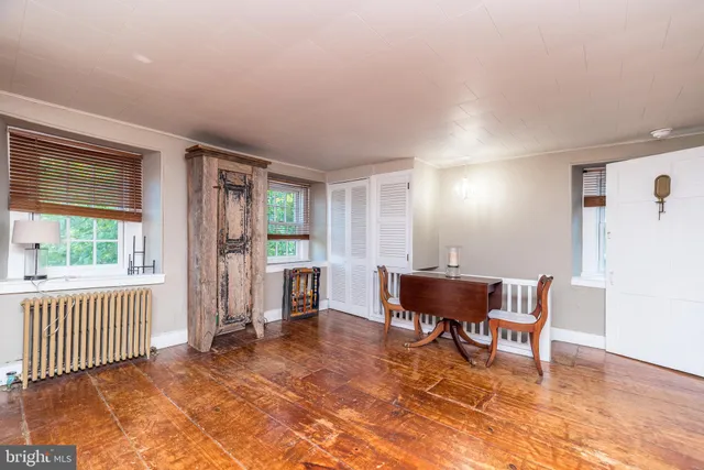 a view of a livingroom with furniture and a window