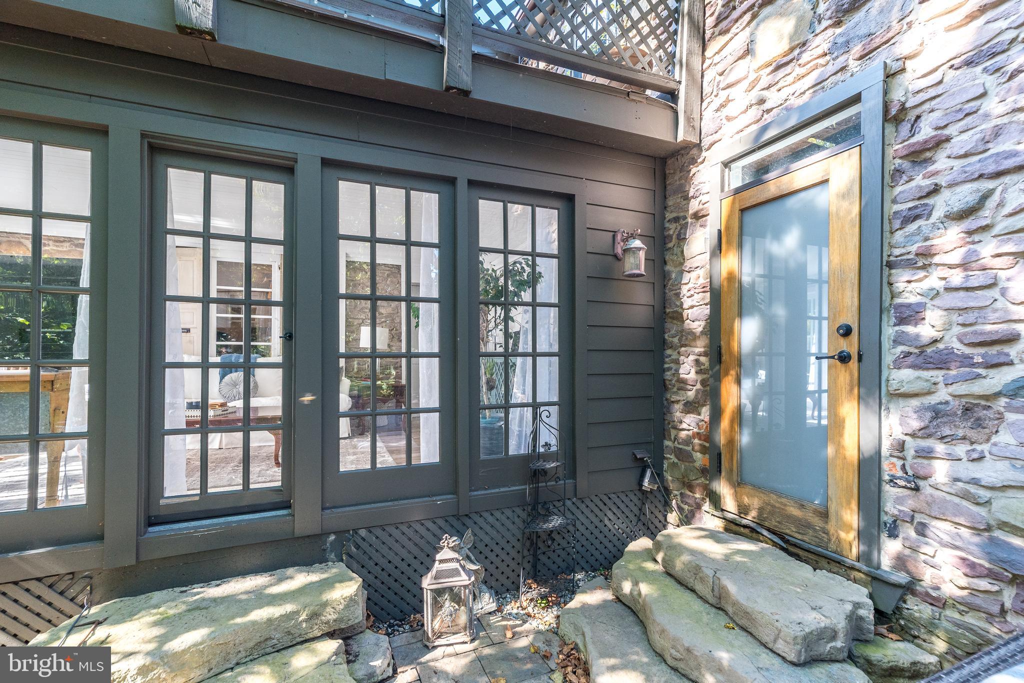 9022 Easton Road Ottsville, PA 18942 - Photo 29 of 45 a living room with furniture and floor to ceiling windows