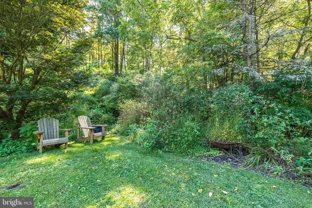 a view of a backyard with sitting area