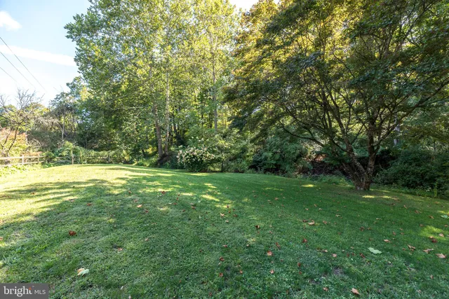 a view of outdoor space with deck and yard