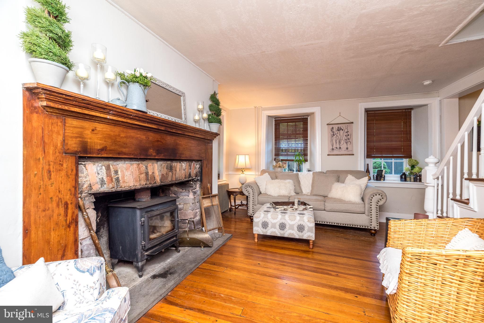 9022 Easton Road Ottsville, PA 18942 - Photo 4 of 45 a living room with furniture and a fireplace