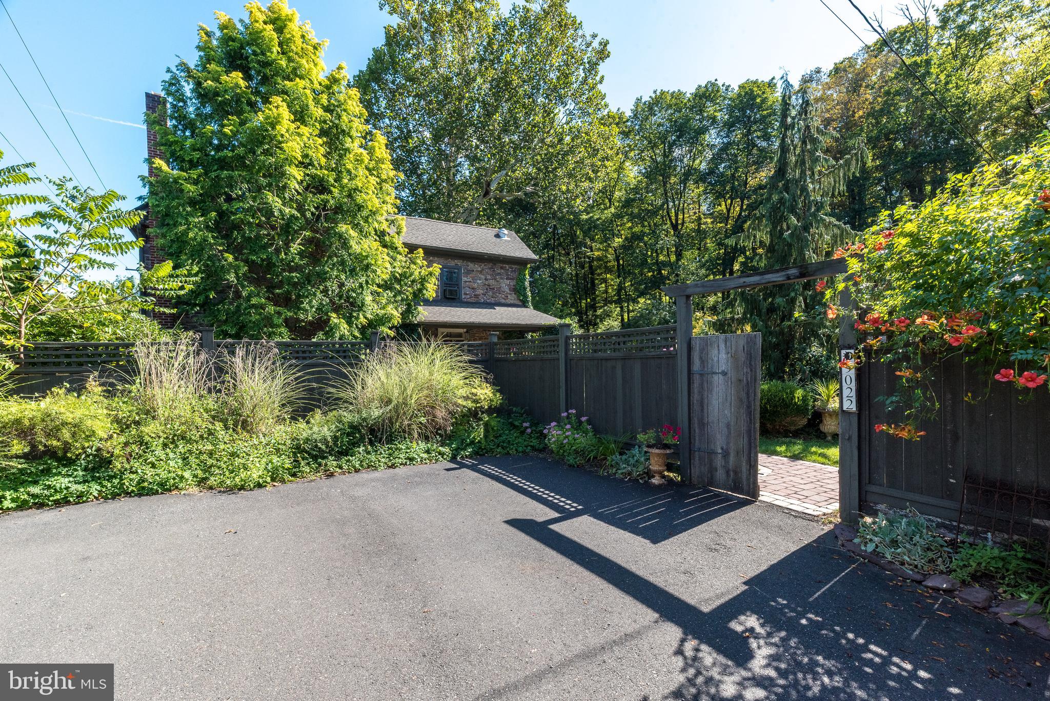 9022 Easton Road Ottsville, PA 18942 - Photo 42 of 45 a view of a garden with potted plants and large trees