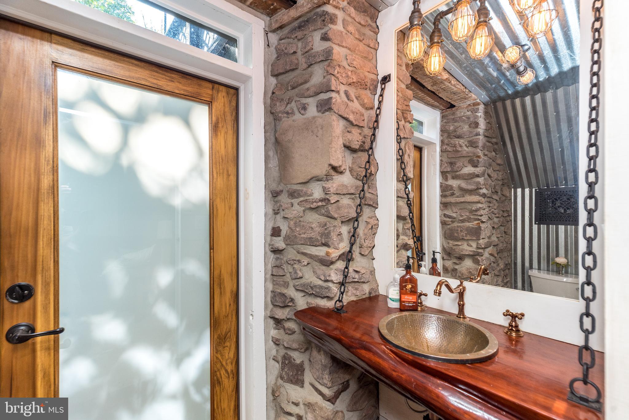 9022 Easton Road Ottsville, PA 18942 - Photo 9 of 45 a bathroom with a sink and a mirror