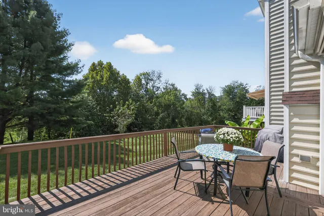a view of a chairs and table on the deck