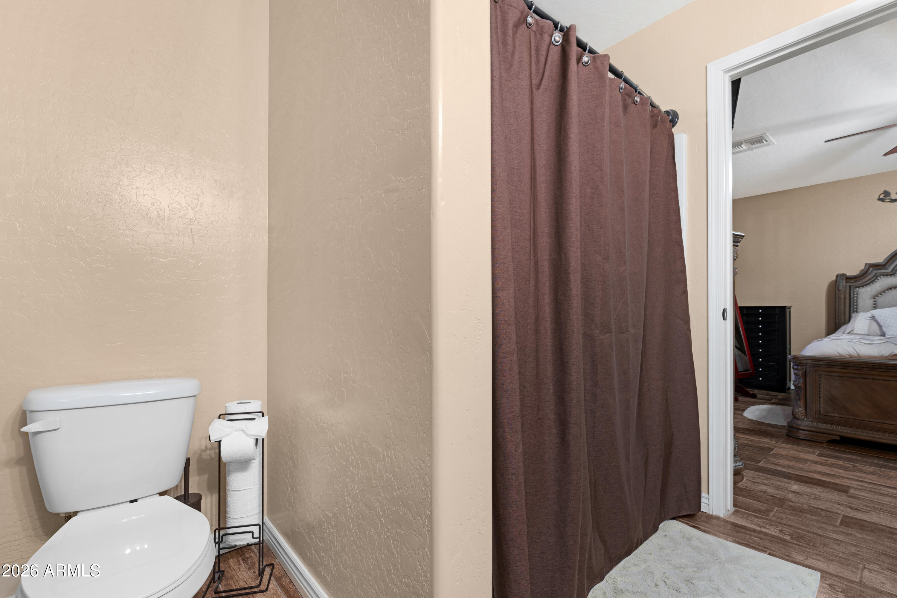 12018 West Almeria Road Avondale, AZ 85392 - Photo 18 of 39 a bathroom with a toilet