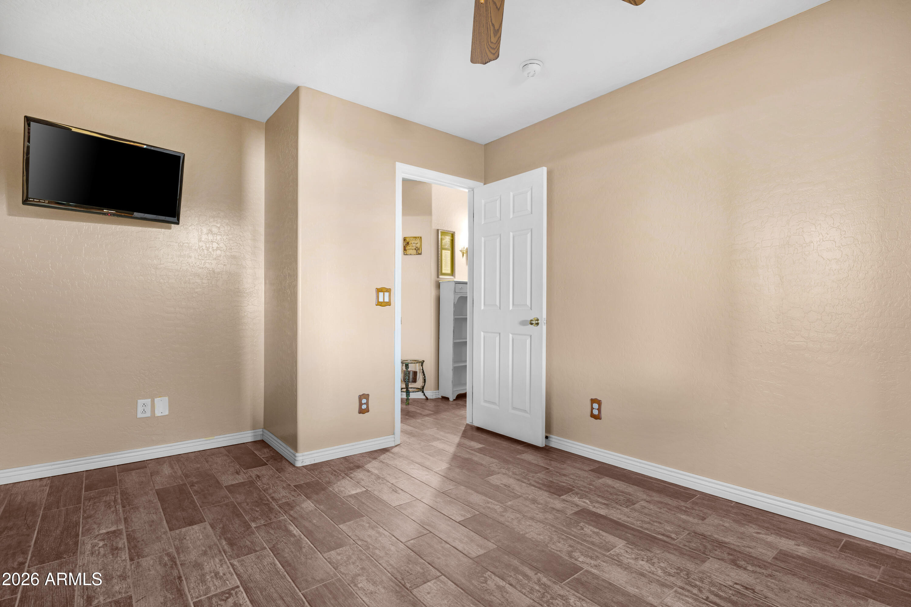 12018 West Almeria Road Avondale, AZ 85392 - Photo 21 of 39 wooden floor in an empty room