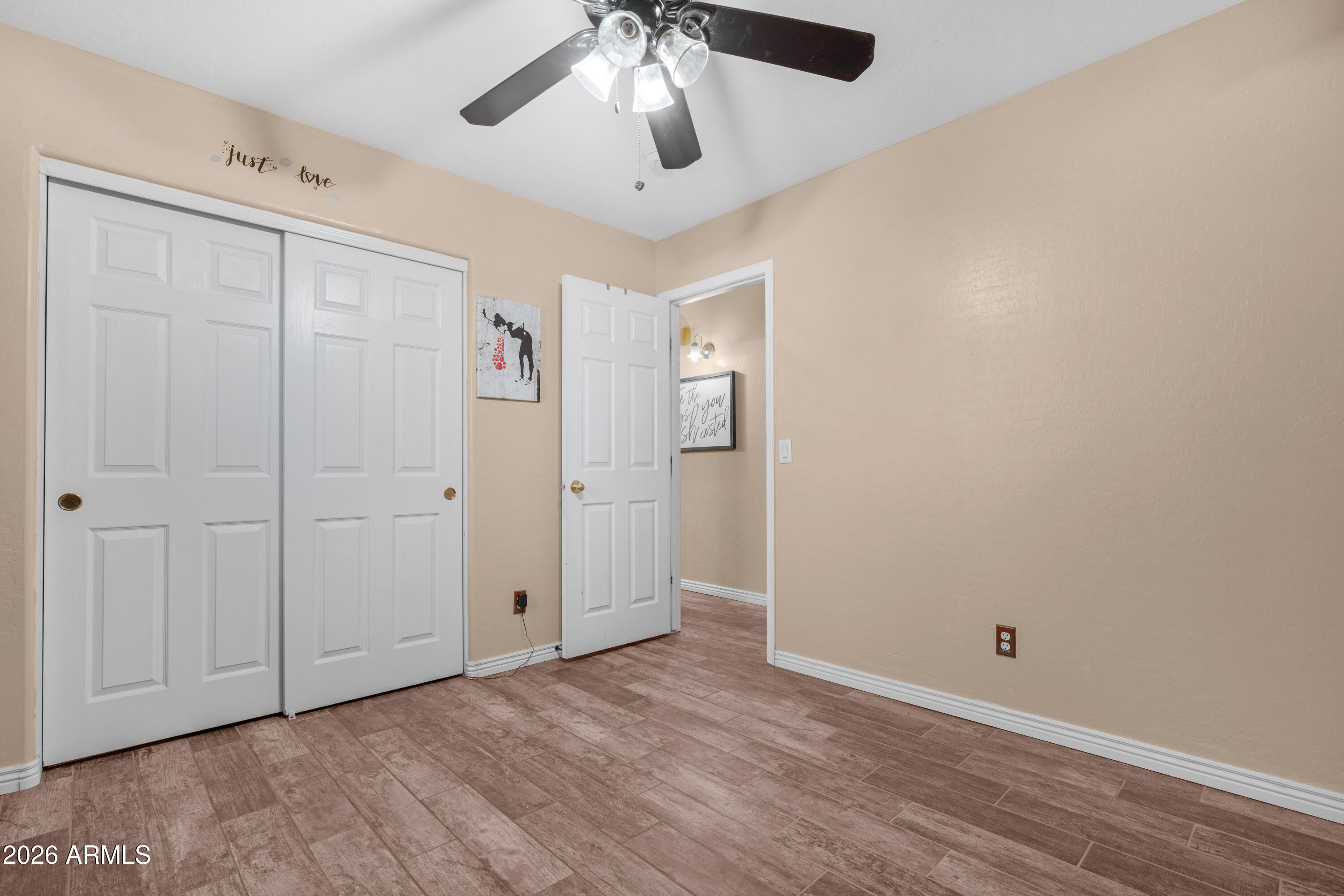 12018 West Almeria Road Avondale, AZ 85392 - Photo 23 of 39 wooden floor in an empty room