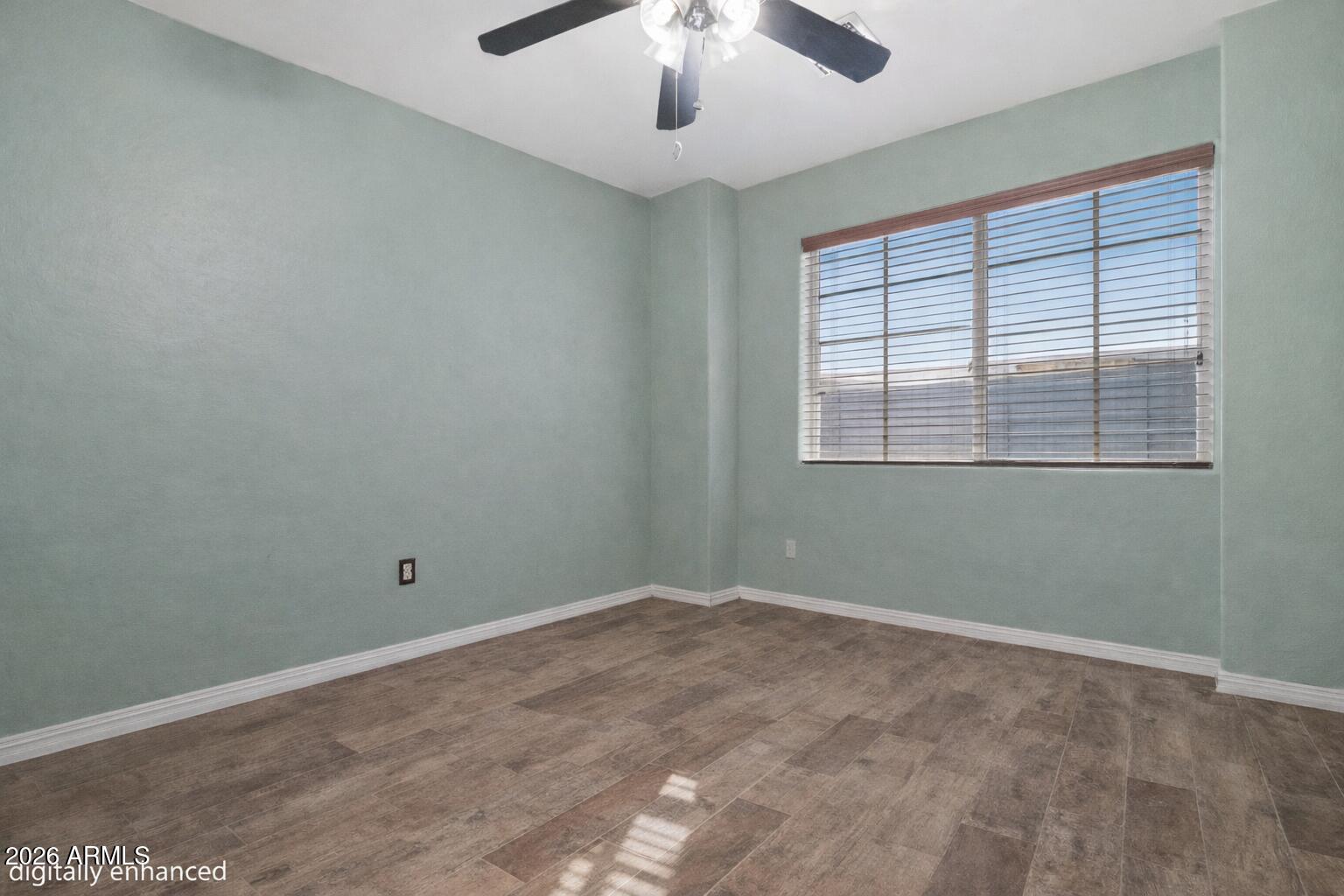 12018 West Almeria Road Avondale, AZ 85392 - Photo 24 of 39 an empty room with a window