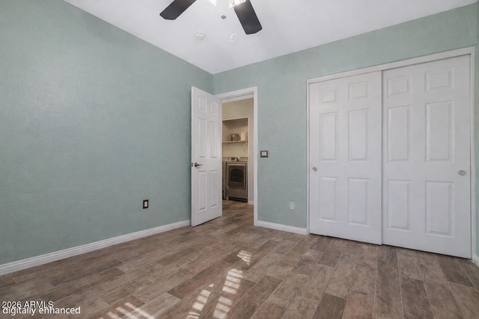 12018 West Almeria Road Avondale, AZ 85392 - Photo 25 of 39 an empty room with closet and windows