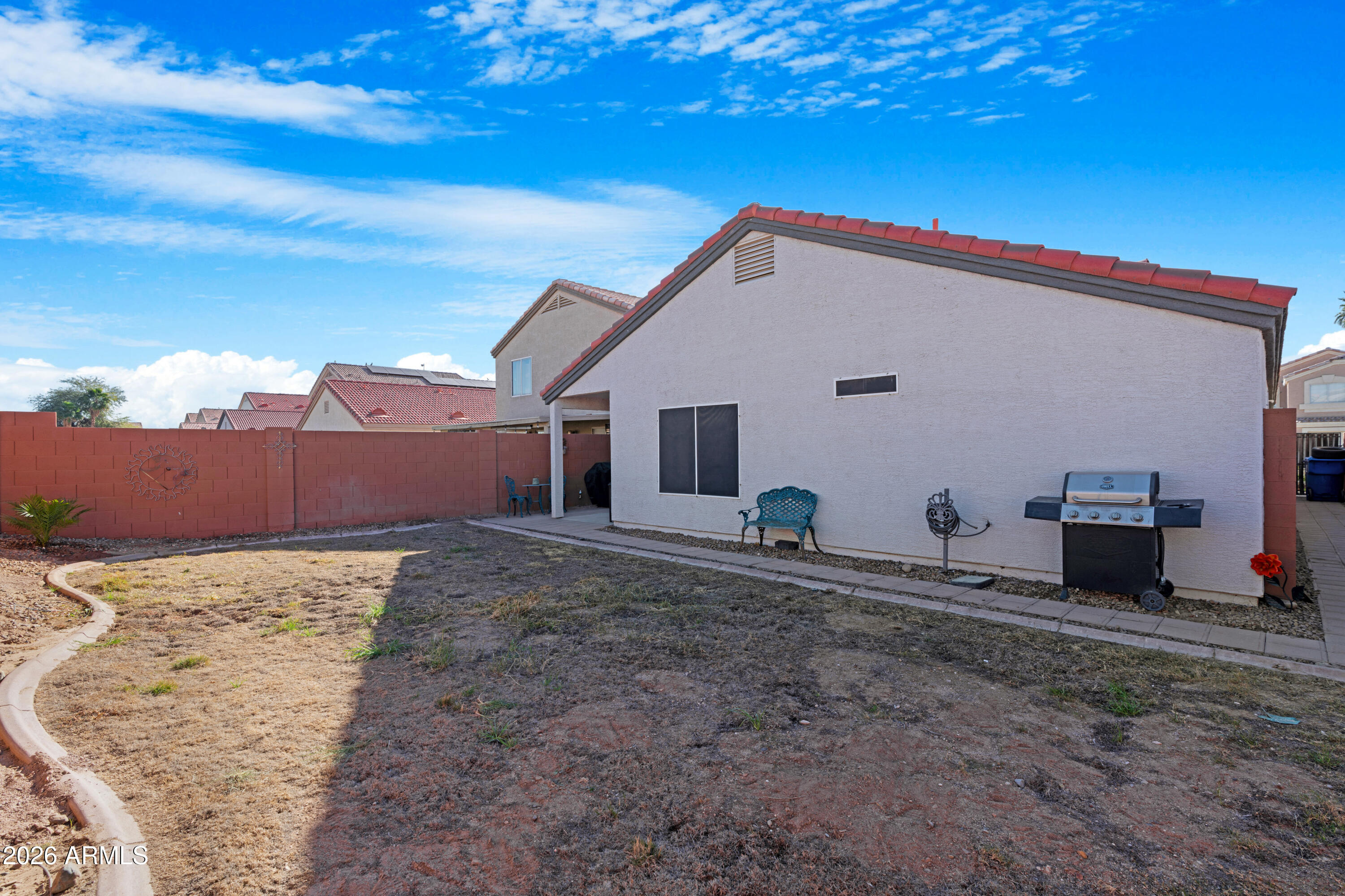 12018 West Almeria Road Avondale, AZ 85392 - Photo 29 of 39 a view of a house with a backyard
