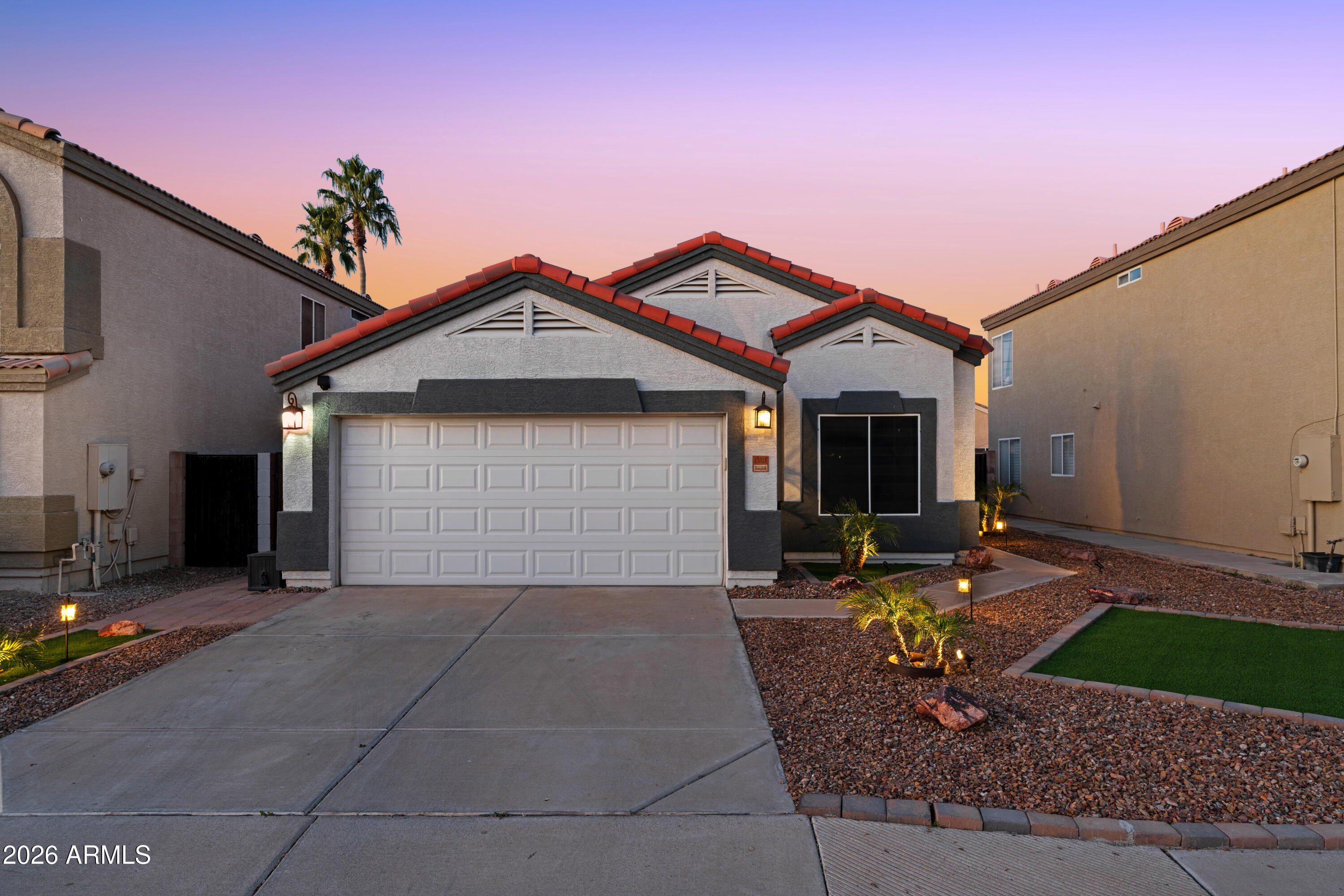 12018 West Almeria Road Avondale, AZ 85392 - Photo 32 of 39 a front view of a house with entertaining space