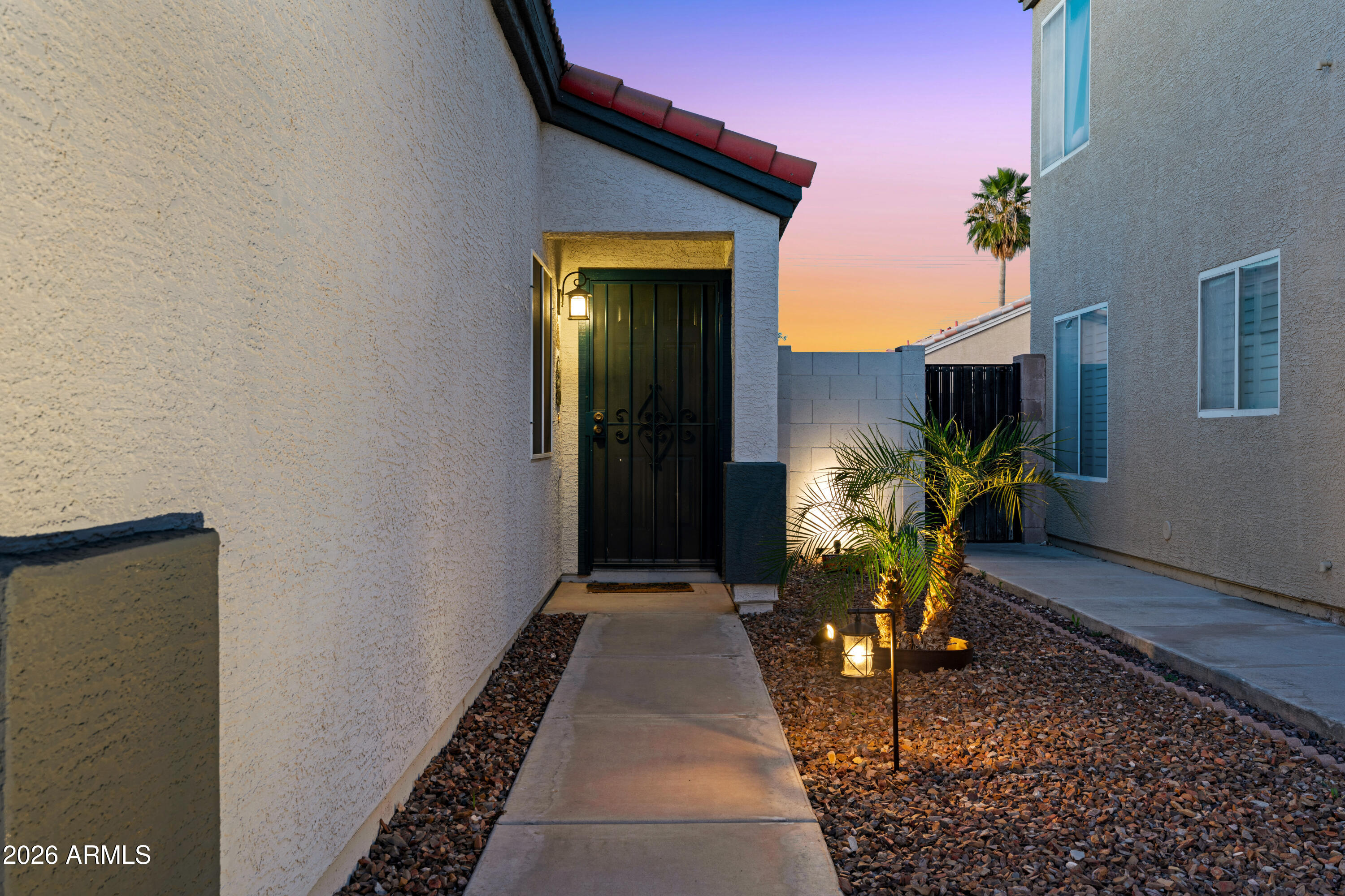 12018 West Almeria Road Avondale, AZ 85392 - Photo 34 of 39 a entryway view with a potted plant