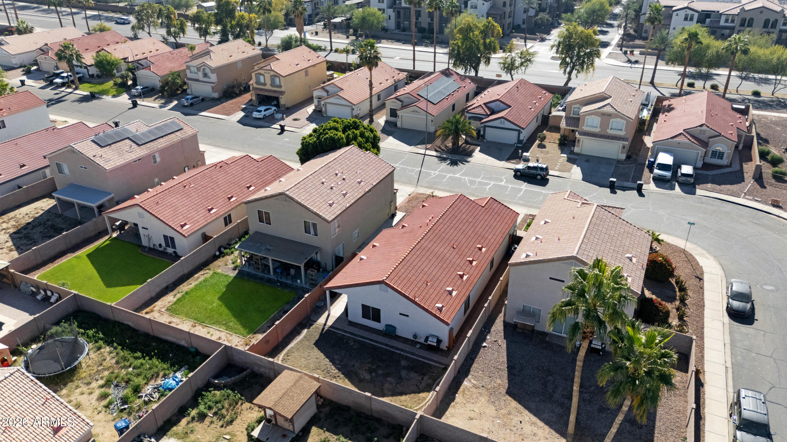 12018 West Almeria Road Avondale, AZ 85392 - Photo 38 of 39 an aerial view of a house with a swimming pool and outdoor seating