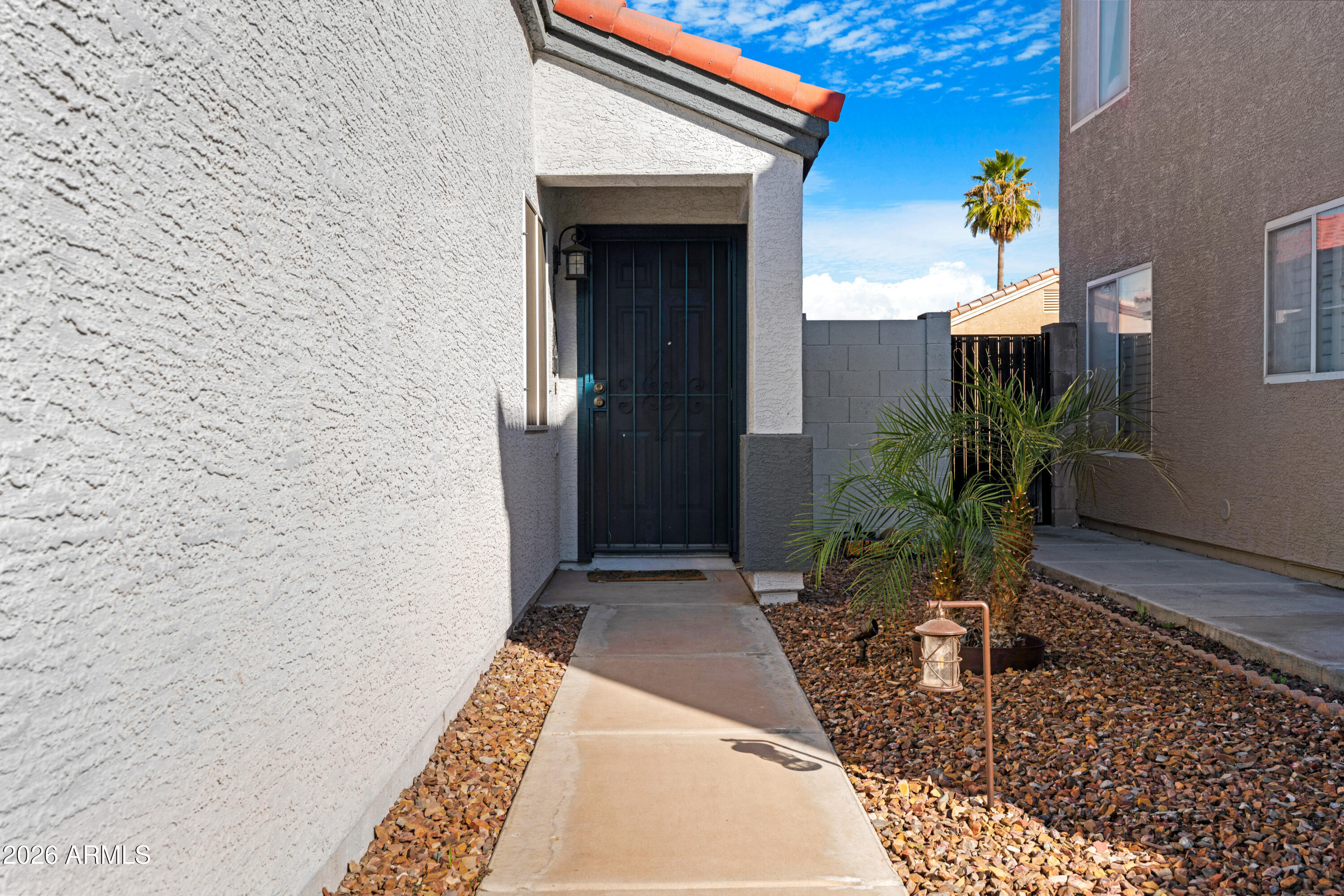 12018 West Almeria Road Avondale, AZ 85392 - Photo 4 of 39 a view of a entryway door of the house