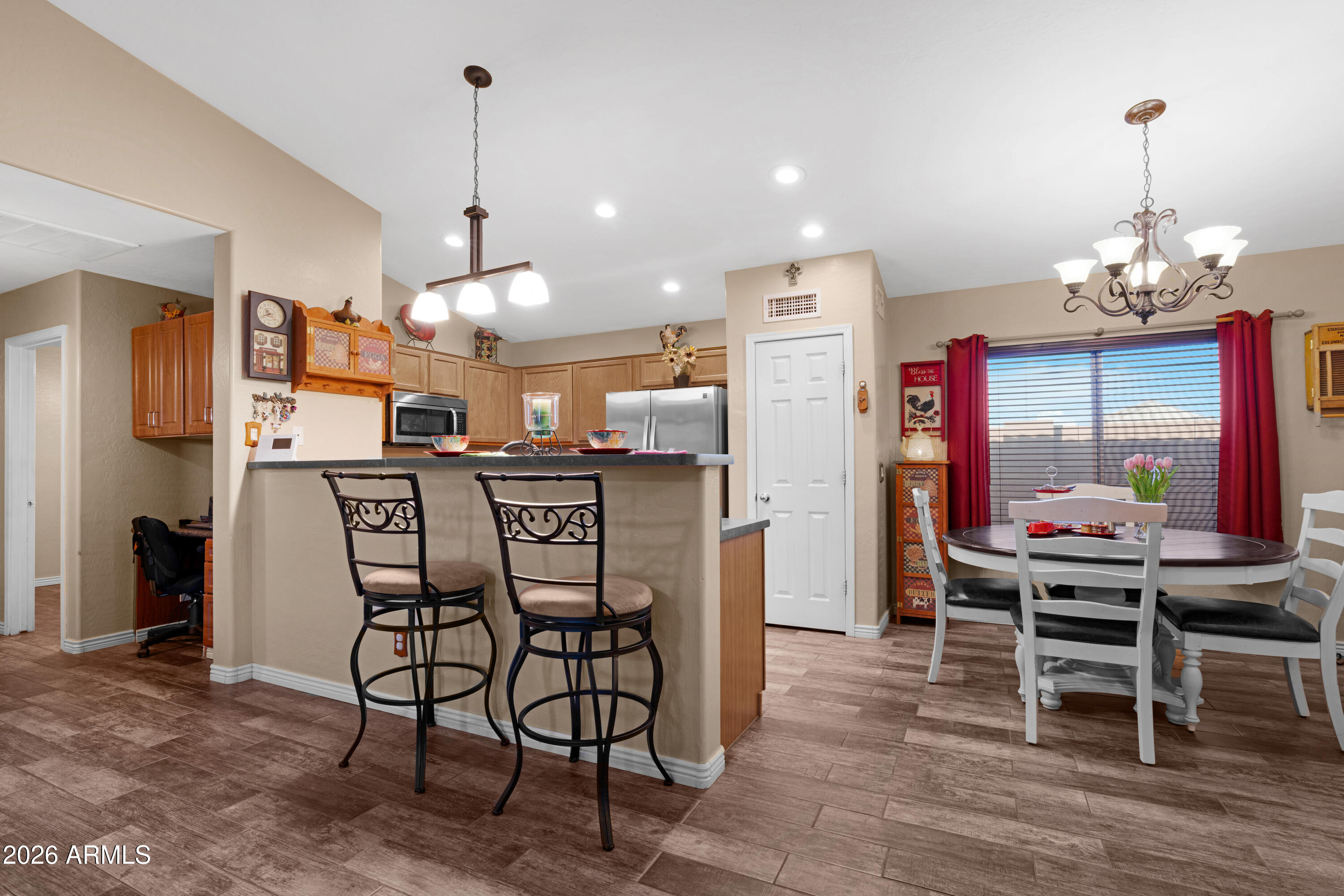 12018 West Almeria Road Avondale, AZ 85392 - Photo 7 of 39 a dining room with furniture and window