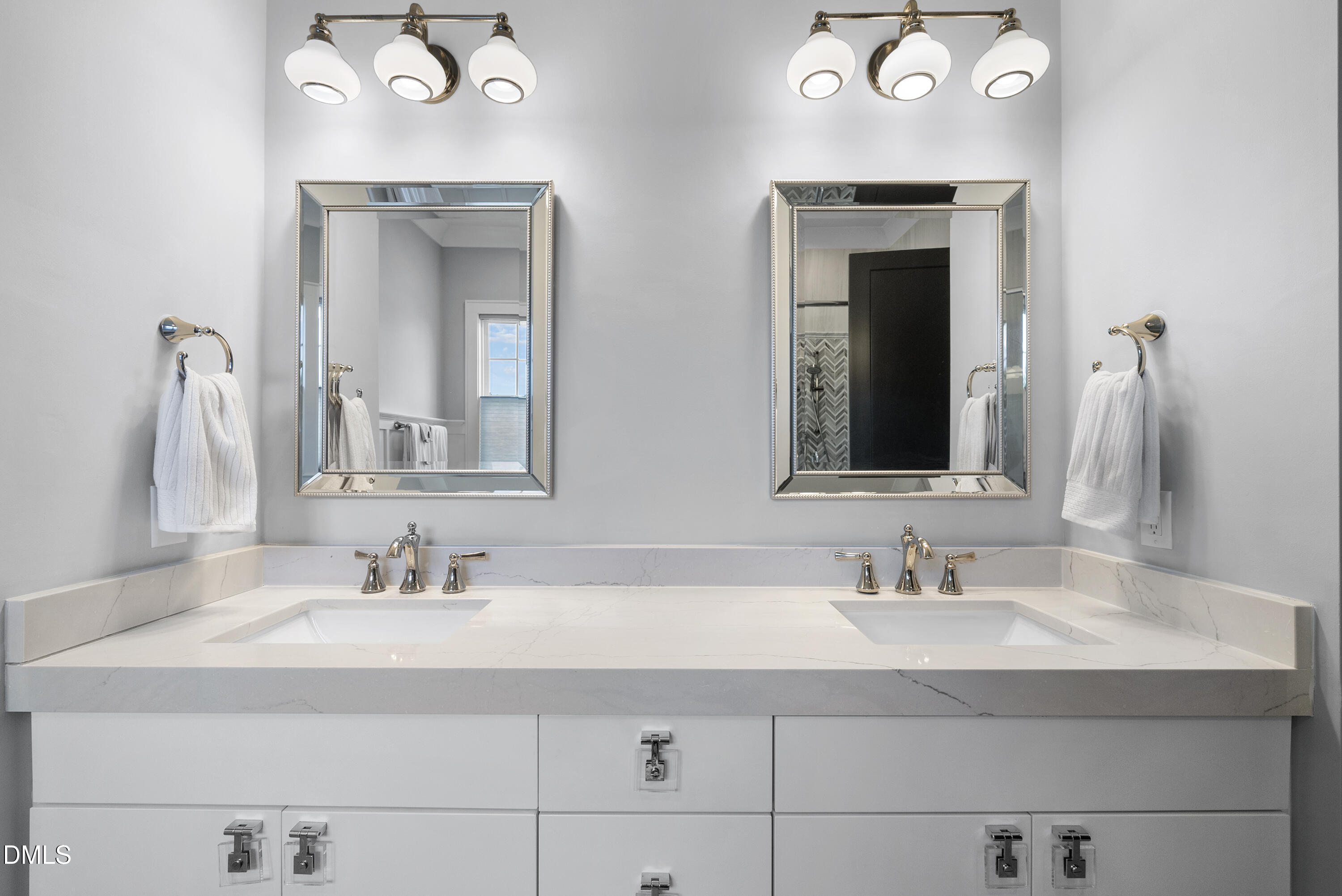 5109 Wainscott Way Raleigh, NC 27612 - Photo 21 of 52 a bathroom with double vanity sink and two mirror