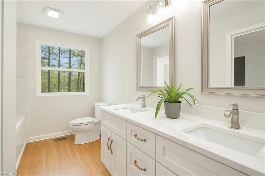4713 Highway 87 Graham, NC 27253 - Photo 24 of 32 Full Bath with Custom Cabinets and New Custom Double Vanity with Quartz Tops and Under Mount Sinks