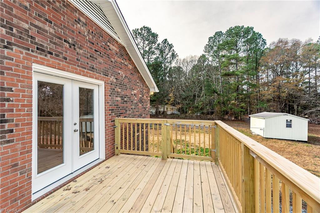 4713 Highway 87 Graham, NC 27253 - Photo 26 of 32 New Large Gated Deck with Side Entry to Family Room