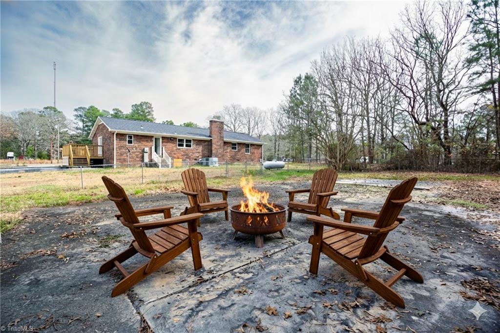 4713 Highway 87 Graham, NC 27253 - Photo 29 of 32 Virtual Staging: Fire Pit on Patio