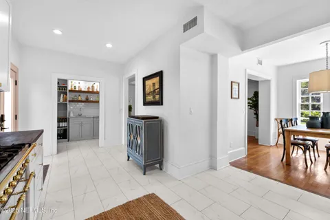 a view of a livingroom with furniture and an empty room
