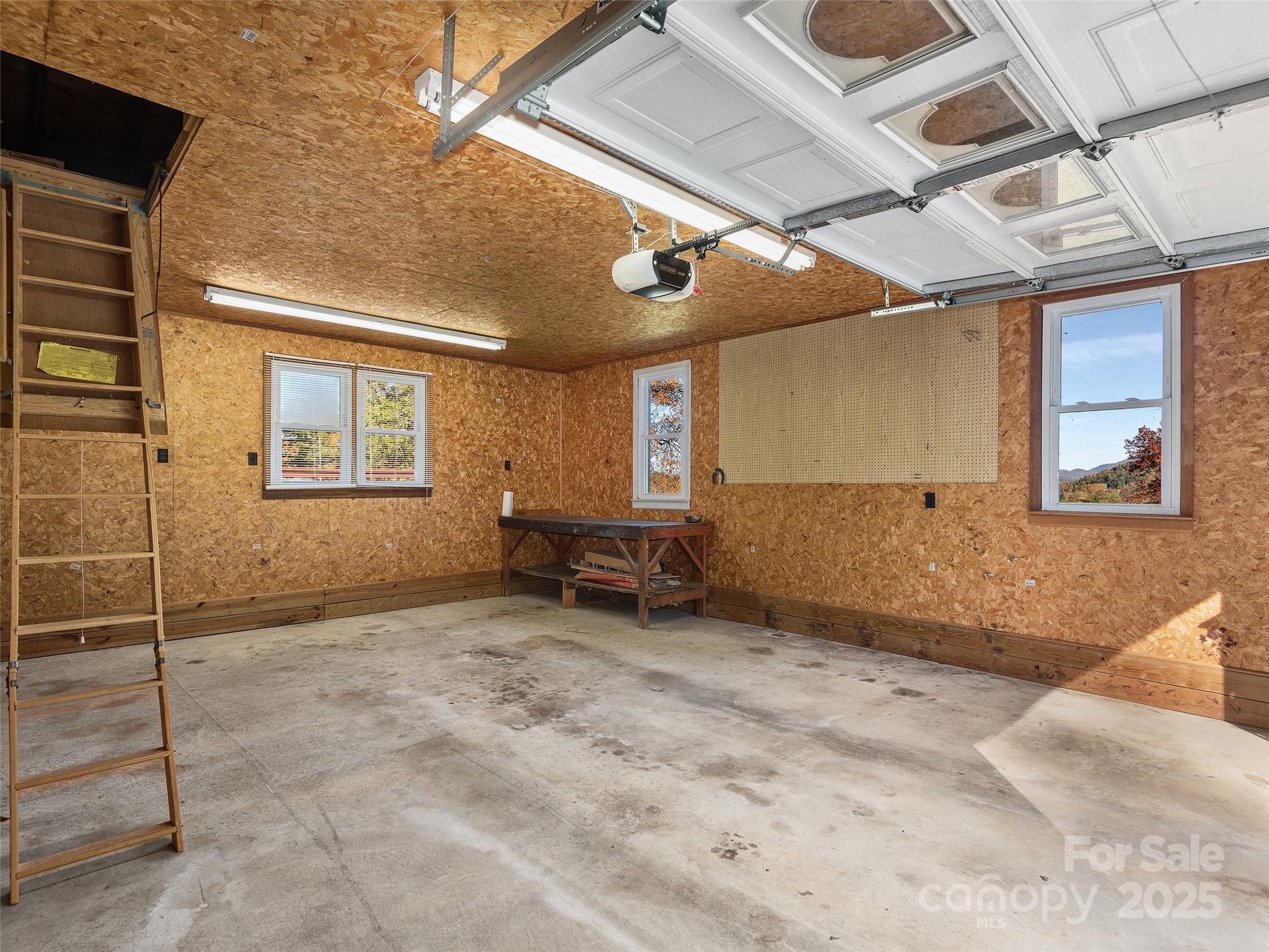 1005 Hutch Mountain Road Fletcher, NC 28732 - Photo 14 of 20 a view of a livingroom with furniture and a ceiling fan
