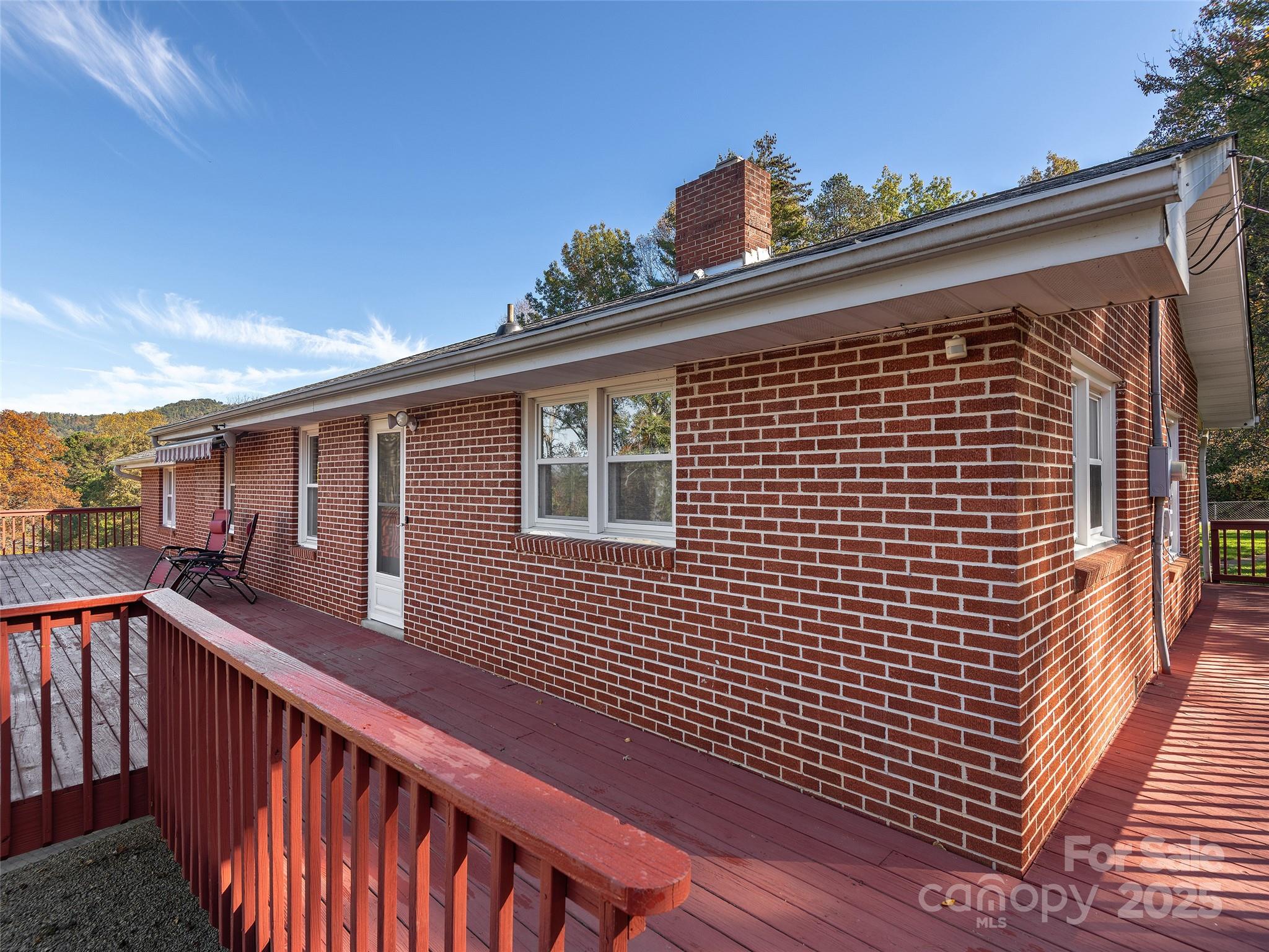 1005 Hutch Mountain Road Fletcher, NC 28732 - Photo 18 of 20 a view of a balcony with wooden floor and fence