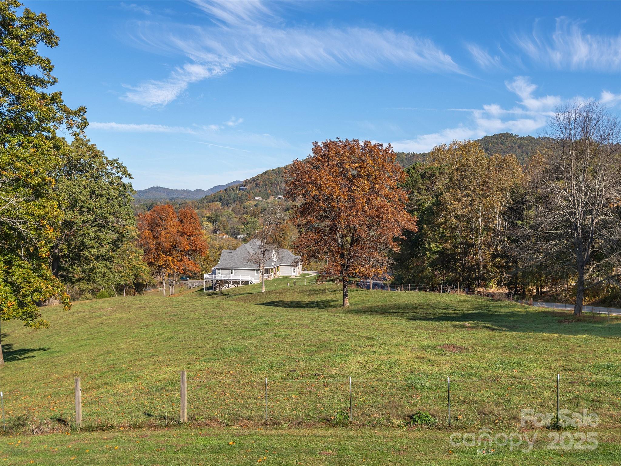 1005 Hutch Mountain Road Fletcher, NC 28732 - Photo 19 of 20 a view of a lake with a mountain in the background