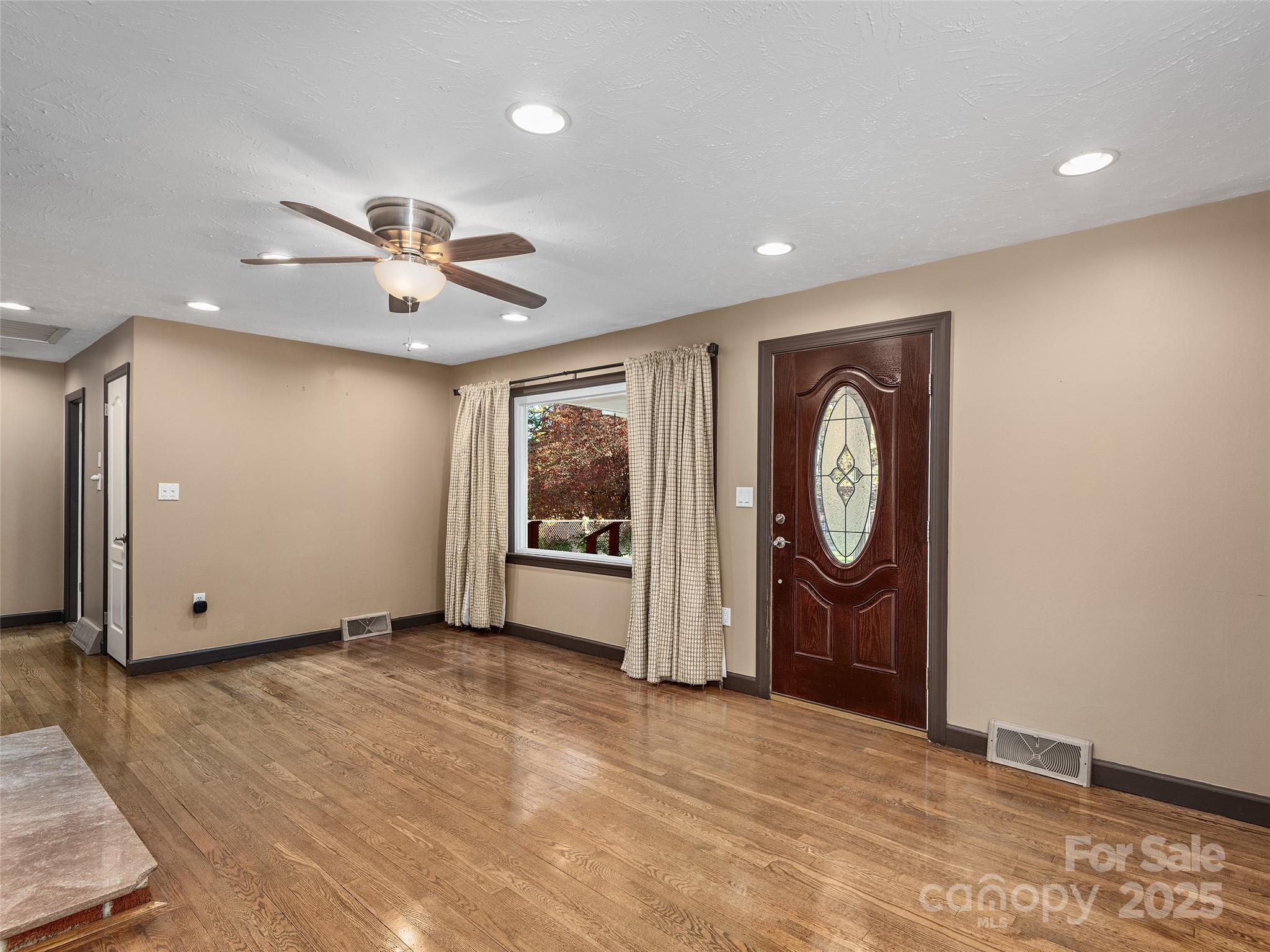 1005 Hutch Mountain Road Fletcher, NC 28732 - Photo 4 of 20 a view of a livingroom with a workspace