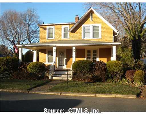 24 Spring Rock Road Branford, CT 06405 - Photo 1 of 1 a front view of a house with garden