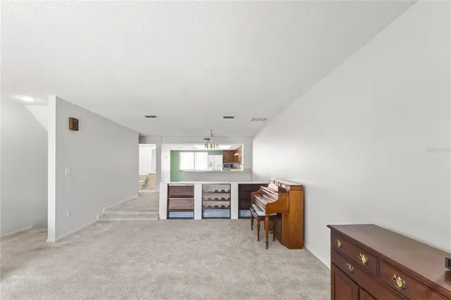 a view of room with window and furniture