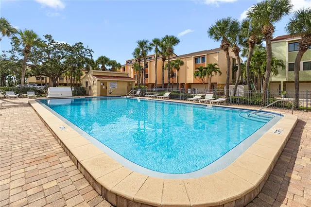 a view of a swimming pool with a house