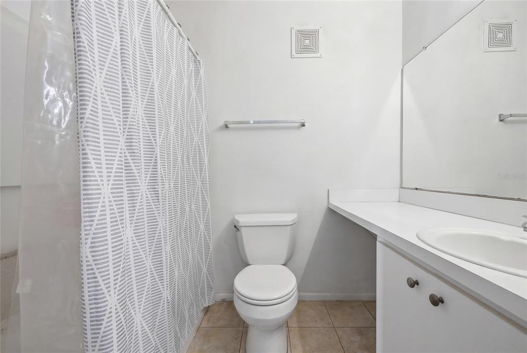 4000 Unit, Unit 3108 Gainesville, FL 32608 - Photo 11 of 20 a white toilet sitting next to a bathroom sink