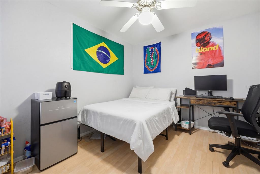 4000 Unit, Unit 3108 Gainesville, FL 32608 - Photo 12 of 20 a bedroom with a bed and a desk