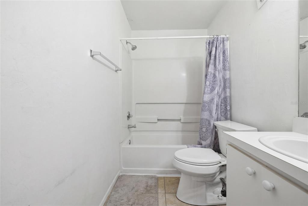 4000 Unit, Unit 3108 Gainesville, FL 32608 - Photo 13 of 20 a bathroom with a toilet and a shower