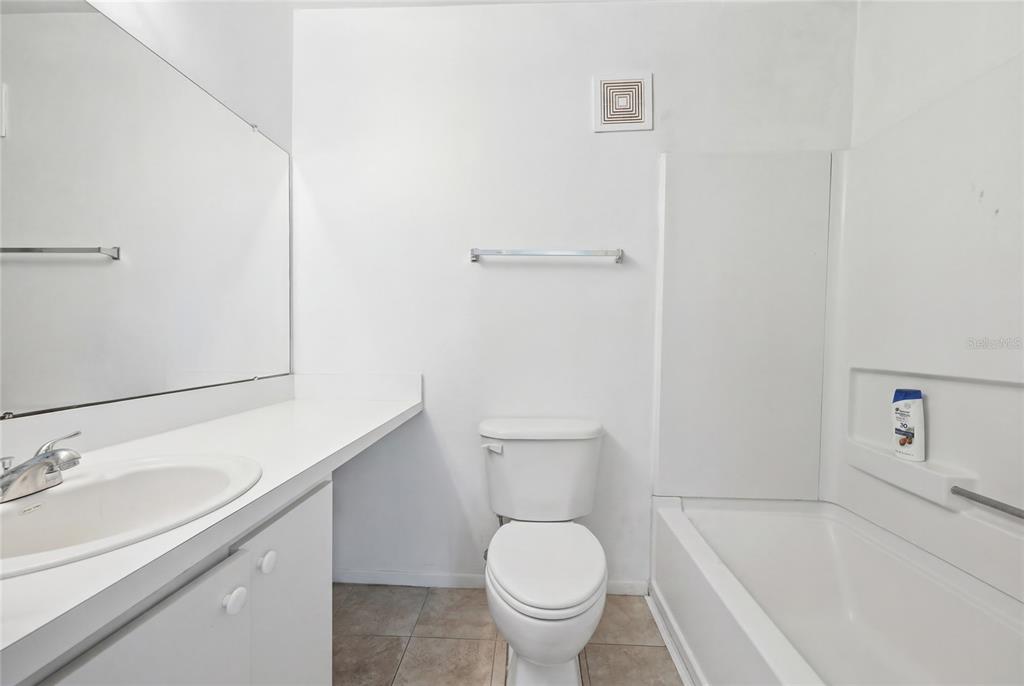 4000 Unit, Unit 3108 Gainesville, FL 32608 - Photo 17 of 20 a bathroom with a sink toilet and shower