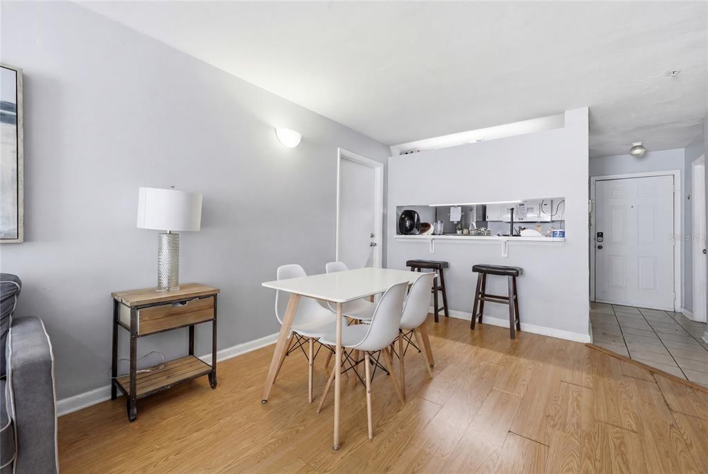 4000 Unit, Unit 3108 Gainesville, FL 32608 - Photo 6 of 20 a view of a dining room with furniture and wooden floor
