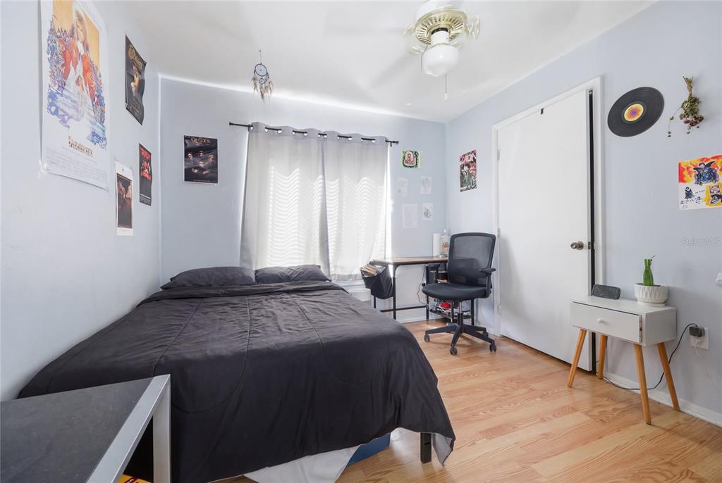 4000 Unit, Unit 3108 Gainesville, FL 32608 - Photo 9 of 20 a bedroom with a bed and a desk