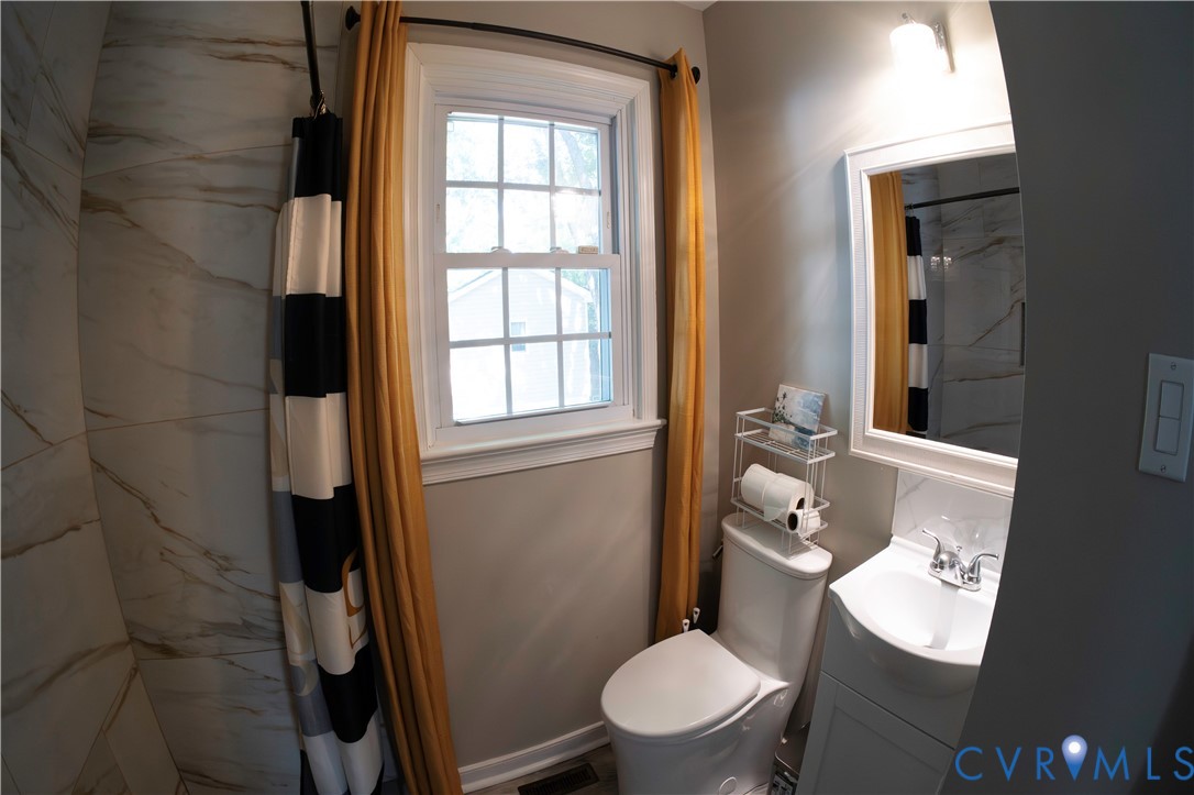 2718 Stacie Road Richmond, VA 23224 - Photo 23 of 50 Bathroom featuring a white vanity with integrated