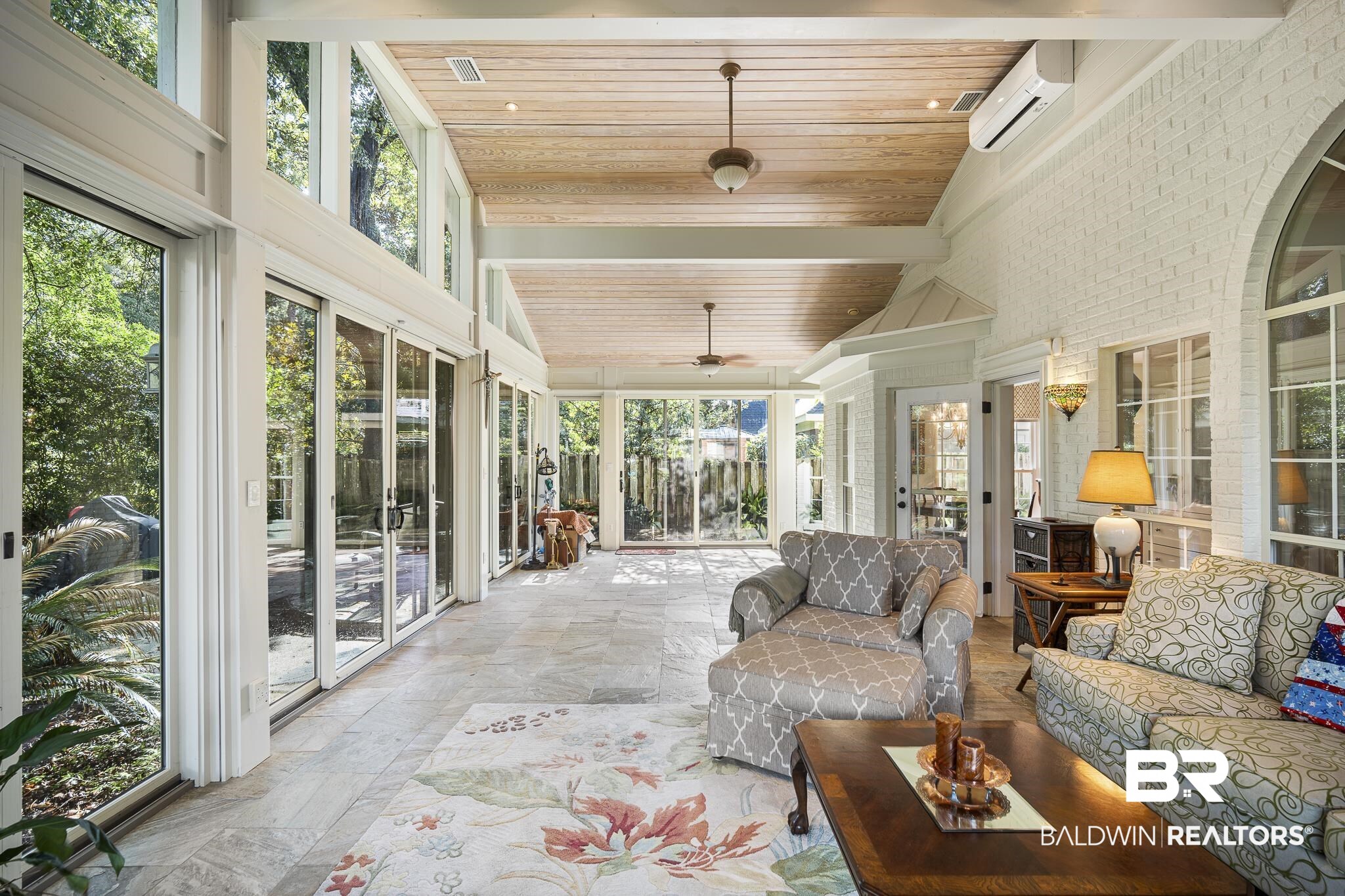 19876 Hunters Loop Fairhope, AL 36532 - Photo 15 of 40 Sunroom featuring outdoor lounge area, healthy amount of natural light, a ceiling fan, and beam ceiling
