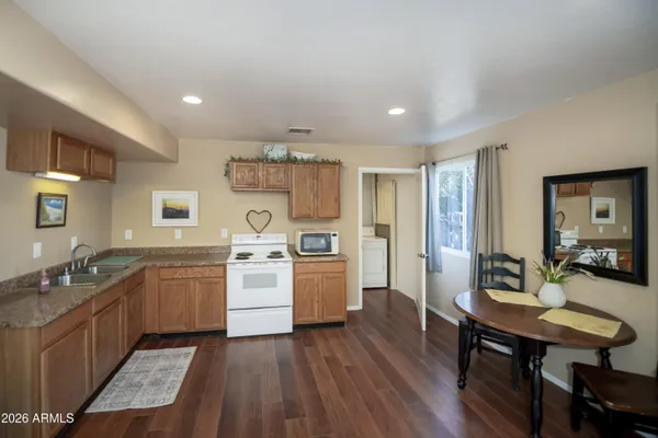 a spacious bedroom with a bed and a view of bedroom