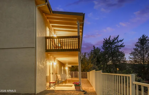 a view of a dinning table and chairs in the patio