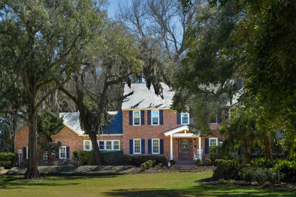 a view of a yard with a house in the background