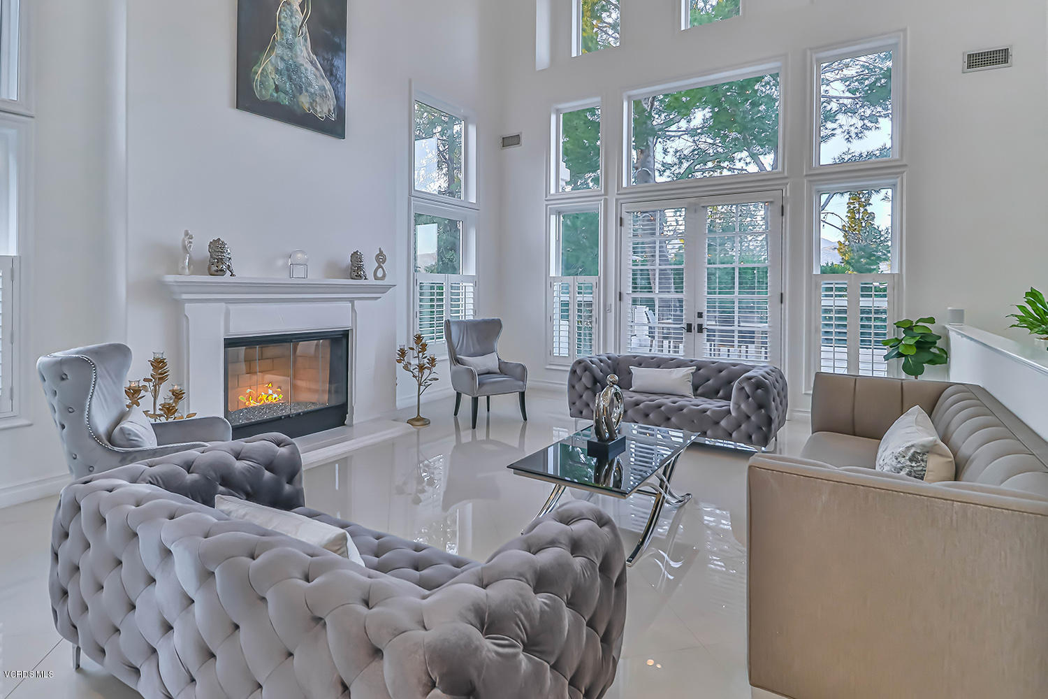 22457 North Summit Ridge Circle Chatsworth, CA 91311 - Photo 11 of 63 a living room with furniture large window and fireplace