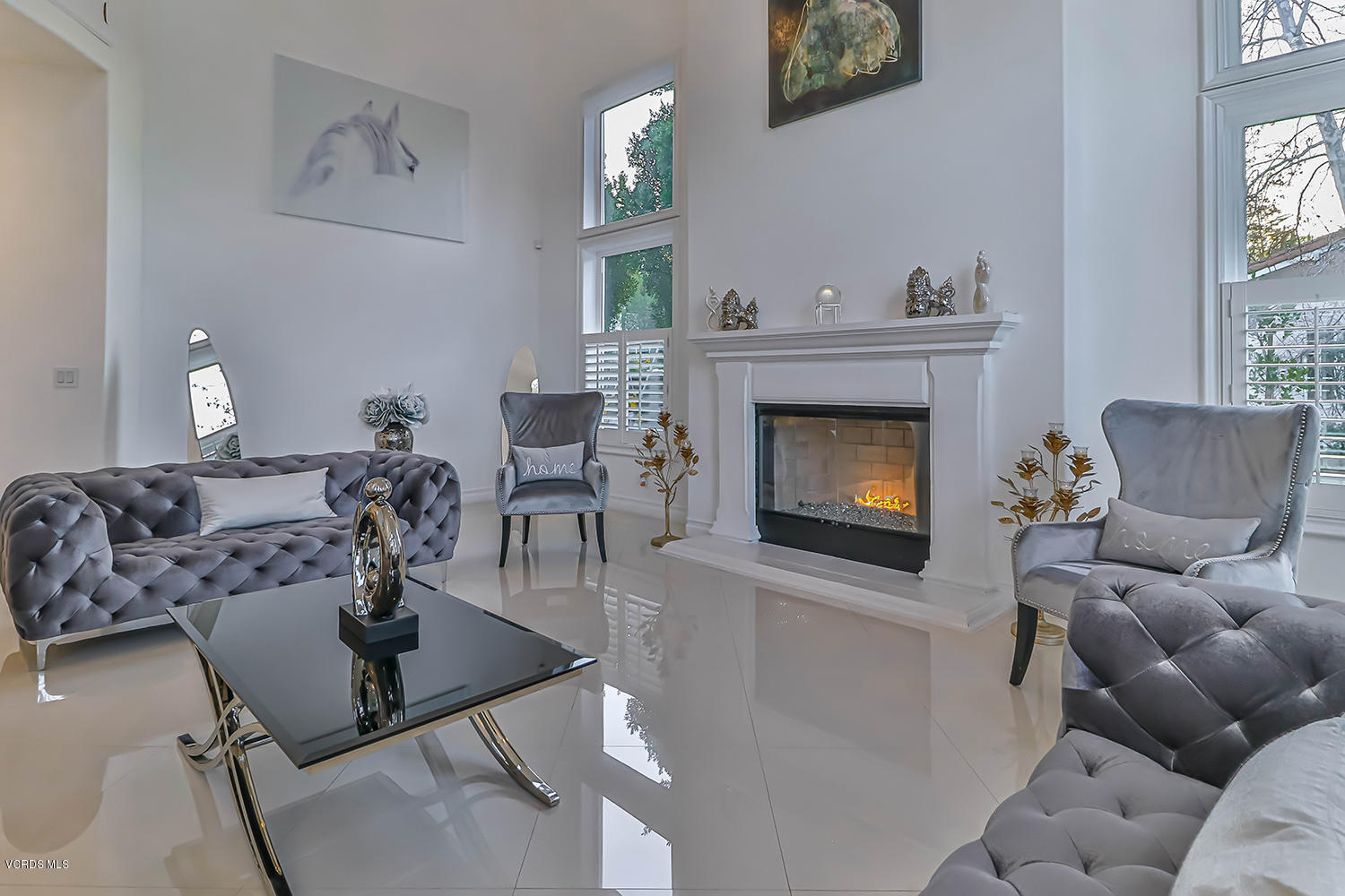 22457 North Summit Ridge Circle Chatsworth, CA 91311 - Photo 12 of 63 a living room with furniture and a fireplace