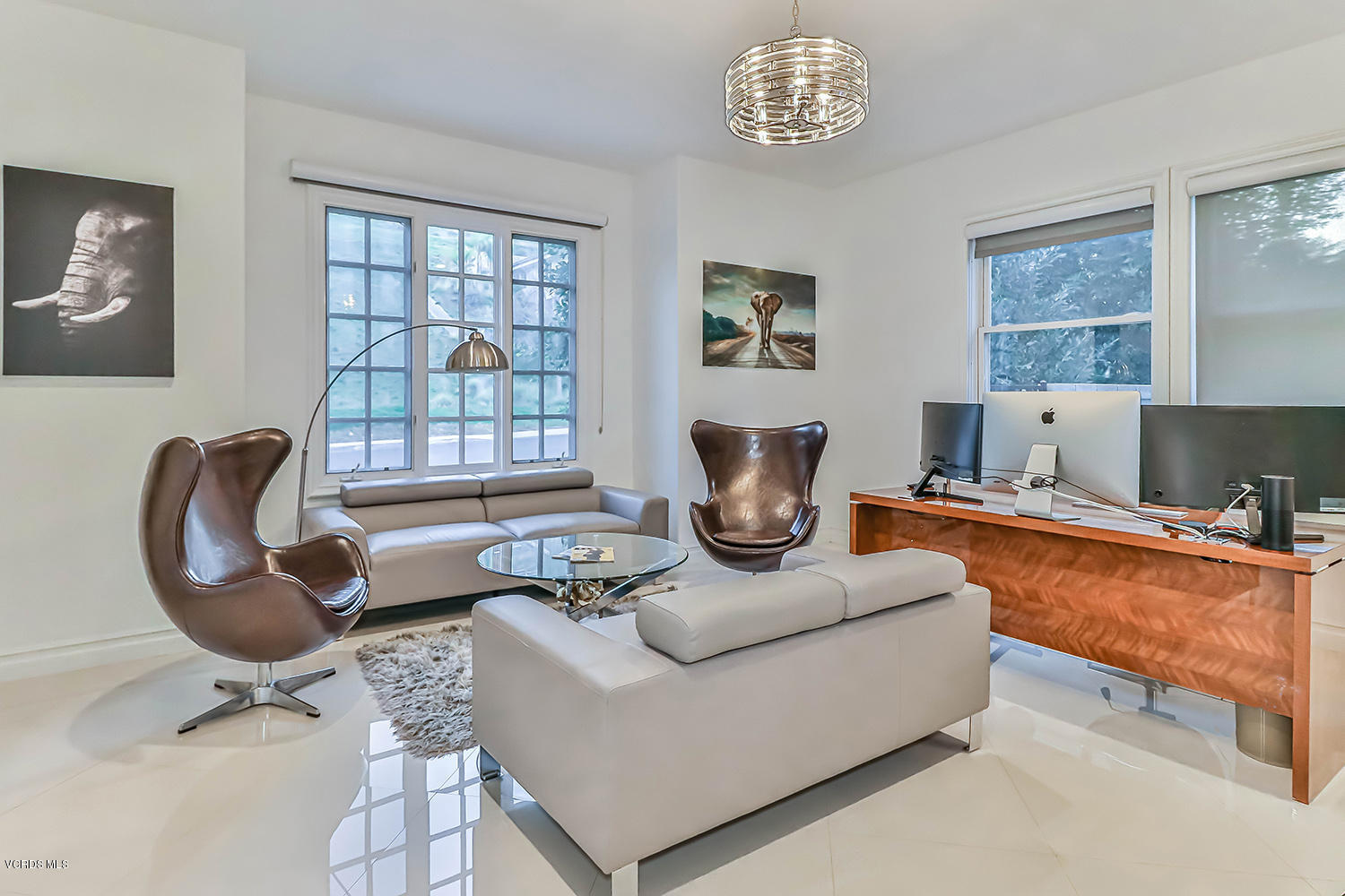 22457 North Summit Ridge Circle Chatsworth, CA 91311 - Photo 26 of 63 a living room with furniture a chandelier and a window