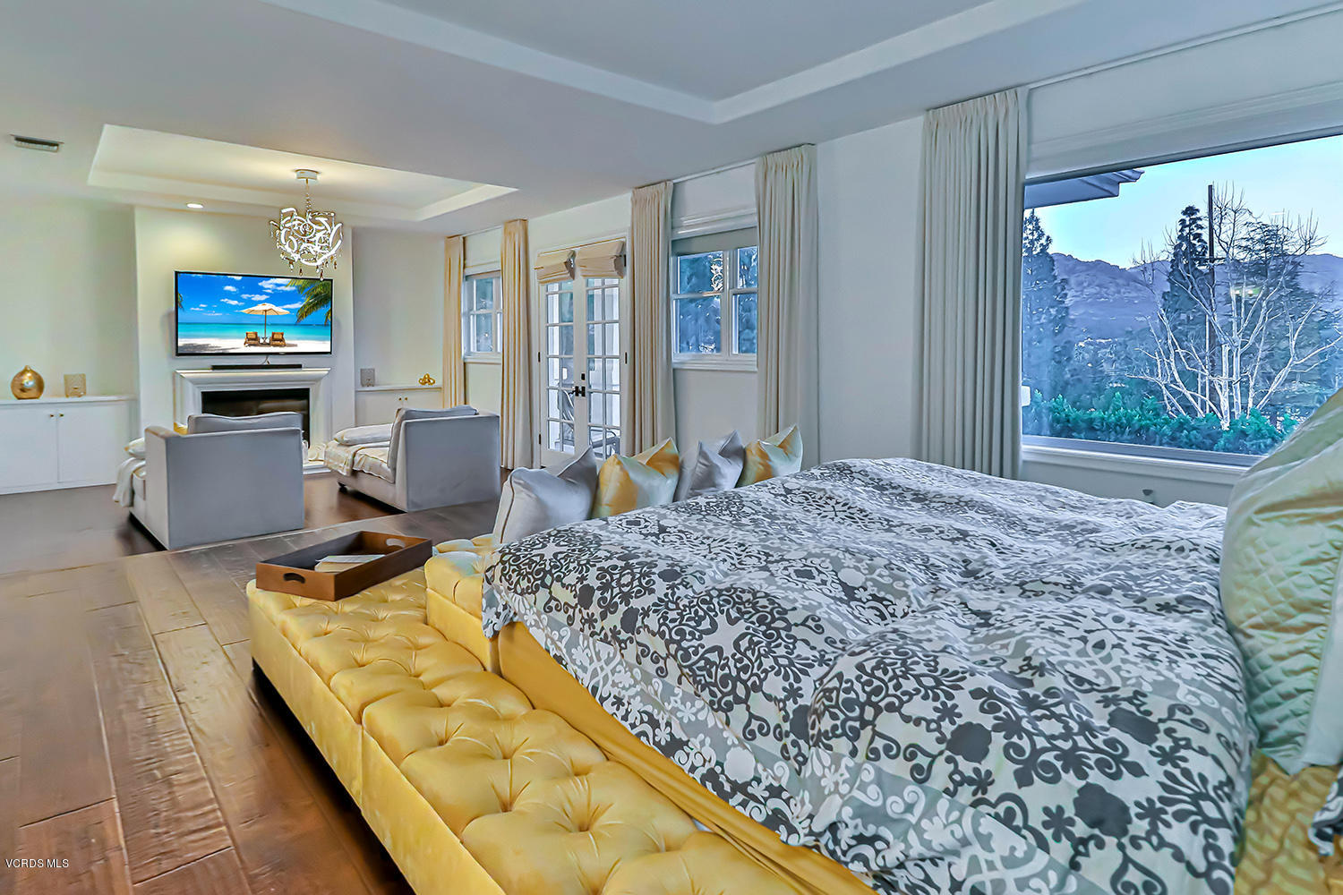 22457 North Summit Ridge Circle Chatsworth, CA 91311 - Photo 34 of 63 a bed sitting in a room next to a window