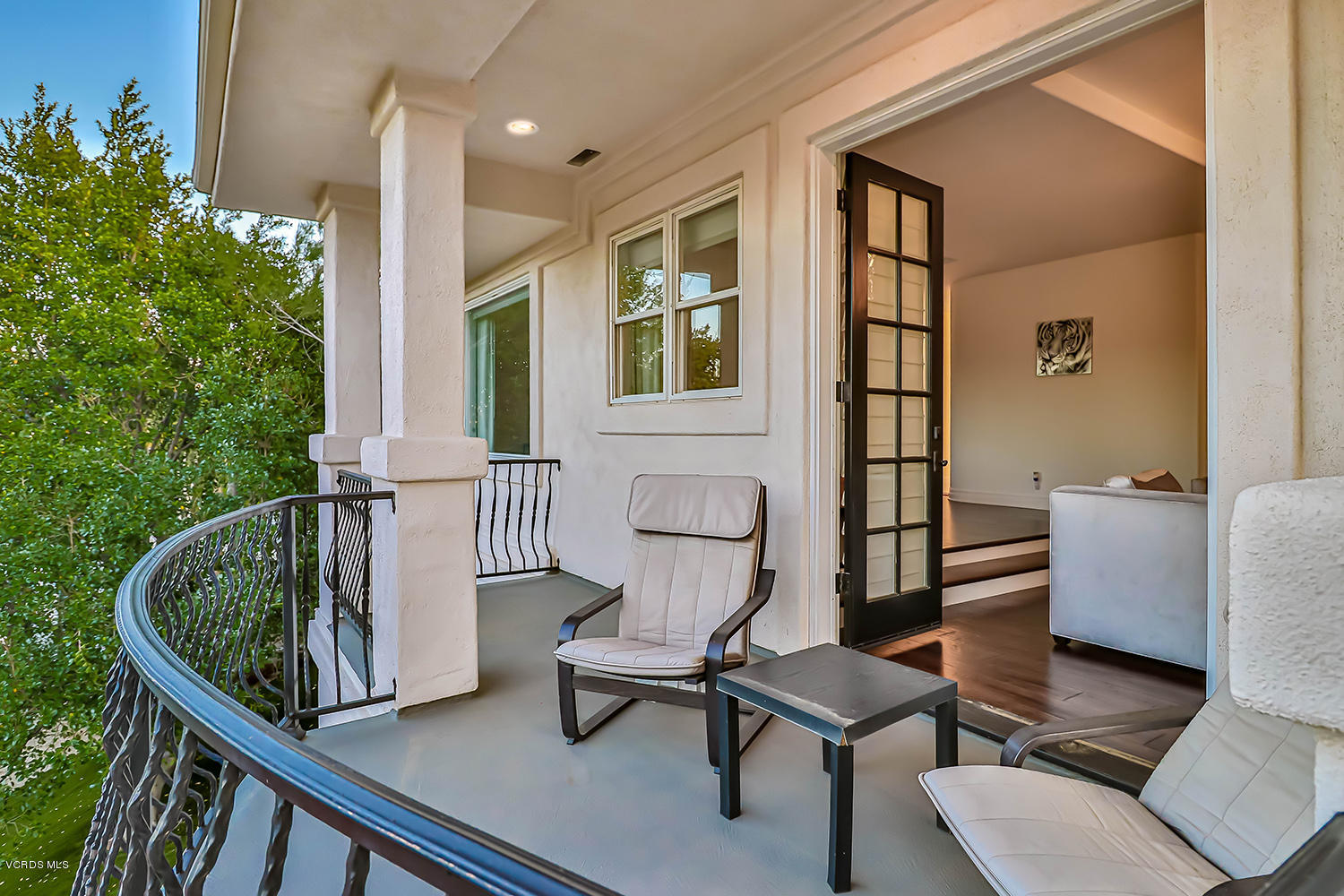 22457 North Summit Ridge Circle Chatsworth, CA 91311 - Photo 37 of 63 a porch with a bench next to a yard